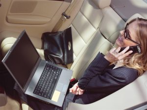 Businesswoman in a Limo - Phoenix Limo Rates